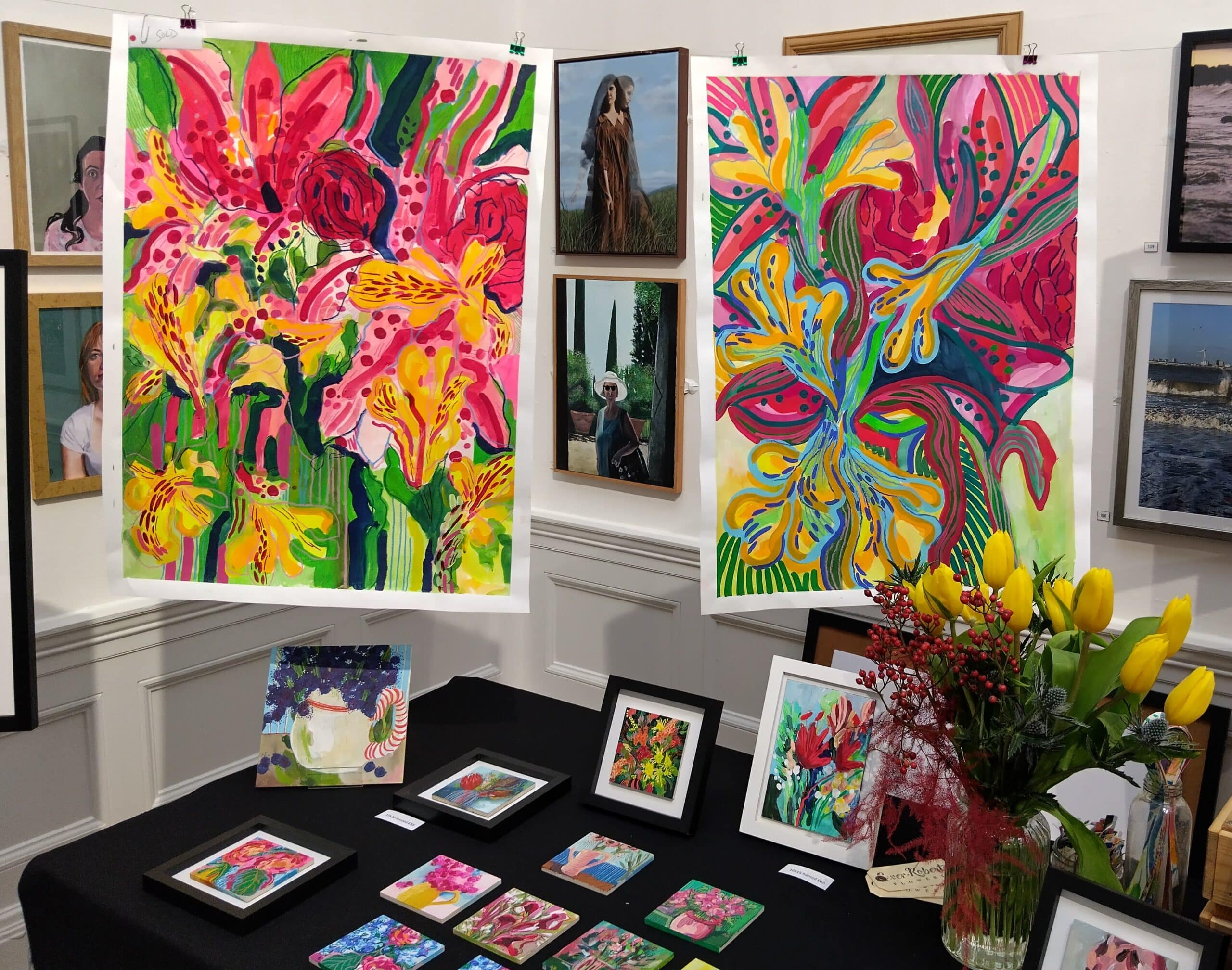Displays of colourful flower artworks. Each art work is a different size